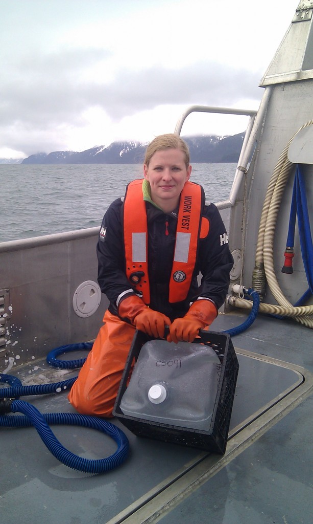 Caitlin McKinstry with a five gallon sample.